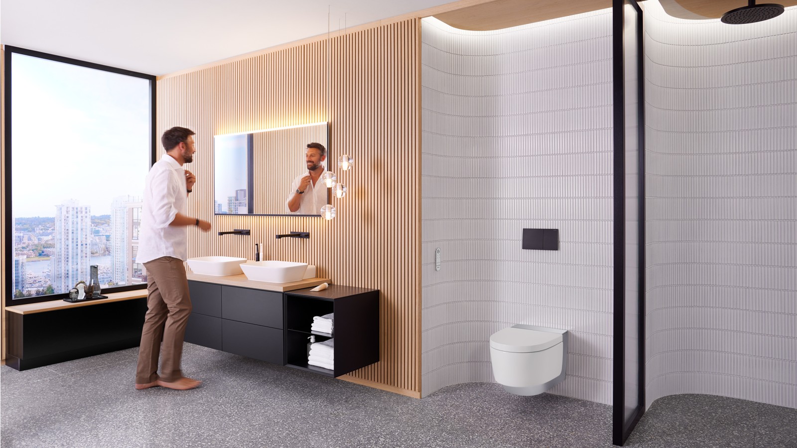 Homme dans une salle de bains devant le miroir Geberit Option Plus Square et des meubles de salle de bains Geberit ONE noirs (© Geberit) Homme dans une salle de bains devant le miroir Geberit Option Plus Square et des meubles de salle de bains Geberit ONE noirs (© Geberit)