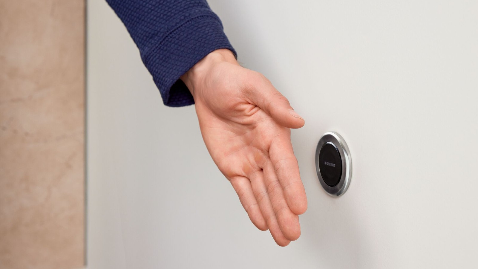 Déclenchement sans contact de la chasse d'eau à distance Geberit Typ10, ronde, avec main Déclenchement sans contact de la chasse d'eau à distance Geberit Typ10, ronde, avec main