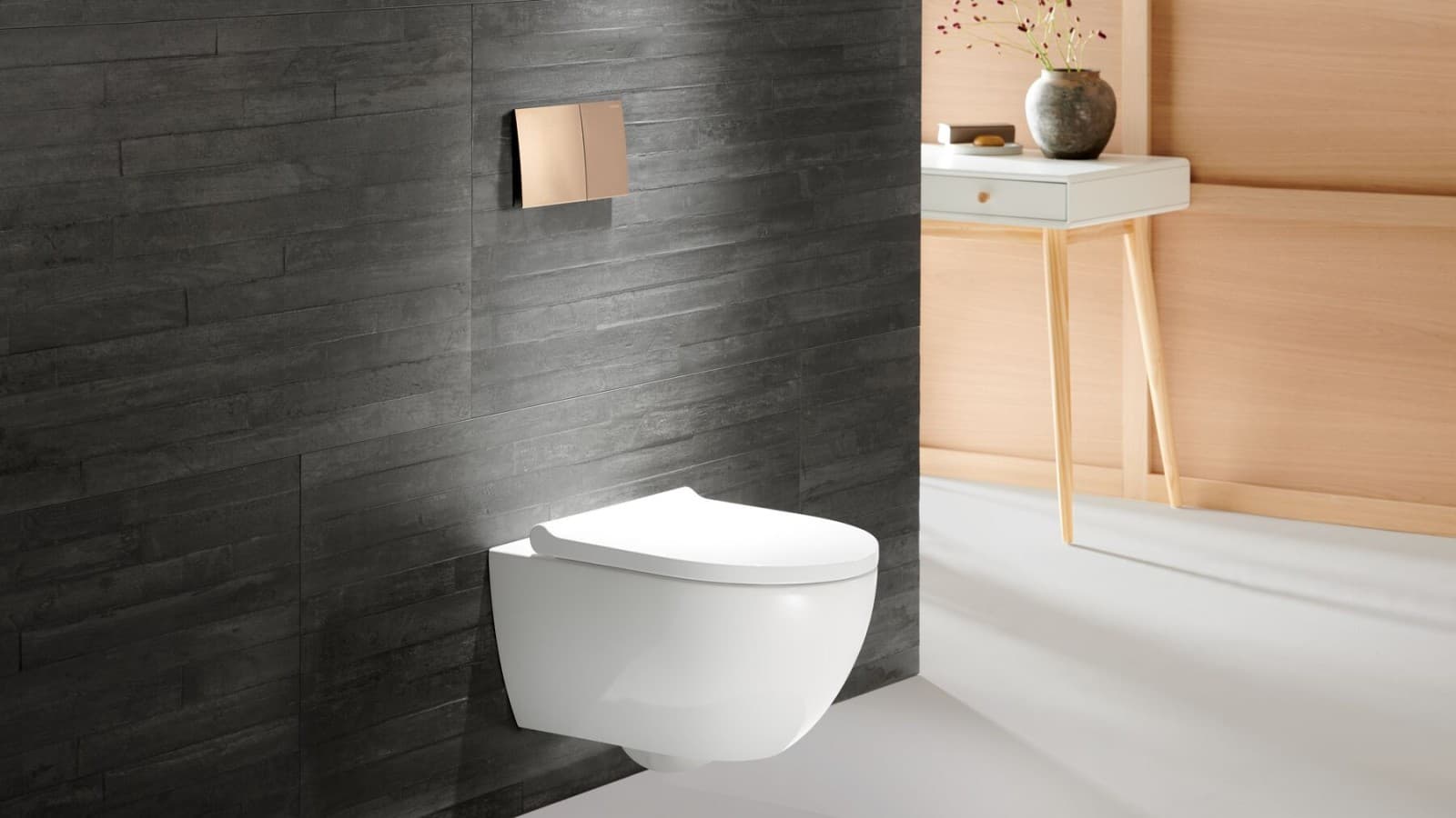 Geberit WC Acanto avec plaque de déclenchement Geberit Sigma70 en or rose Geberit WC Acanto avec plaque de déclenchement Geberit Sigma70 en or rose